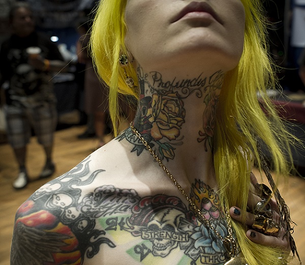 A tattooed girl poses during the 15th An